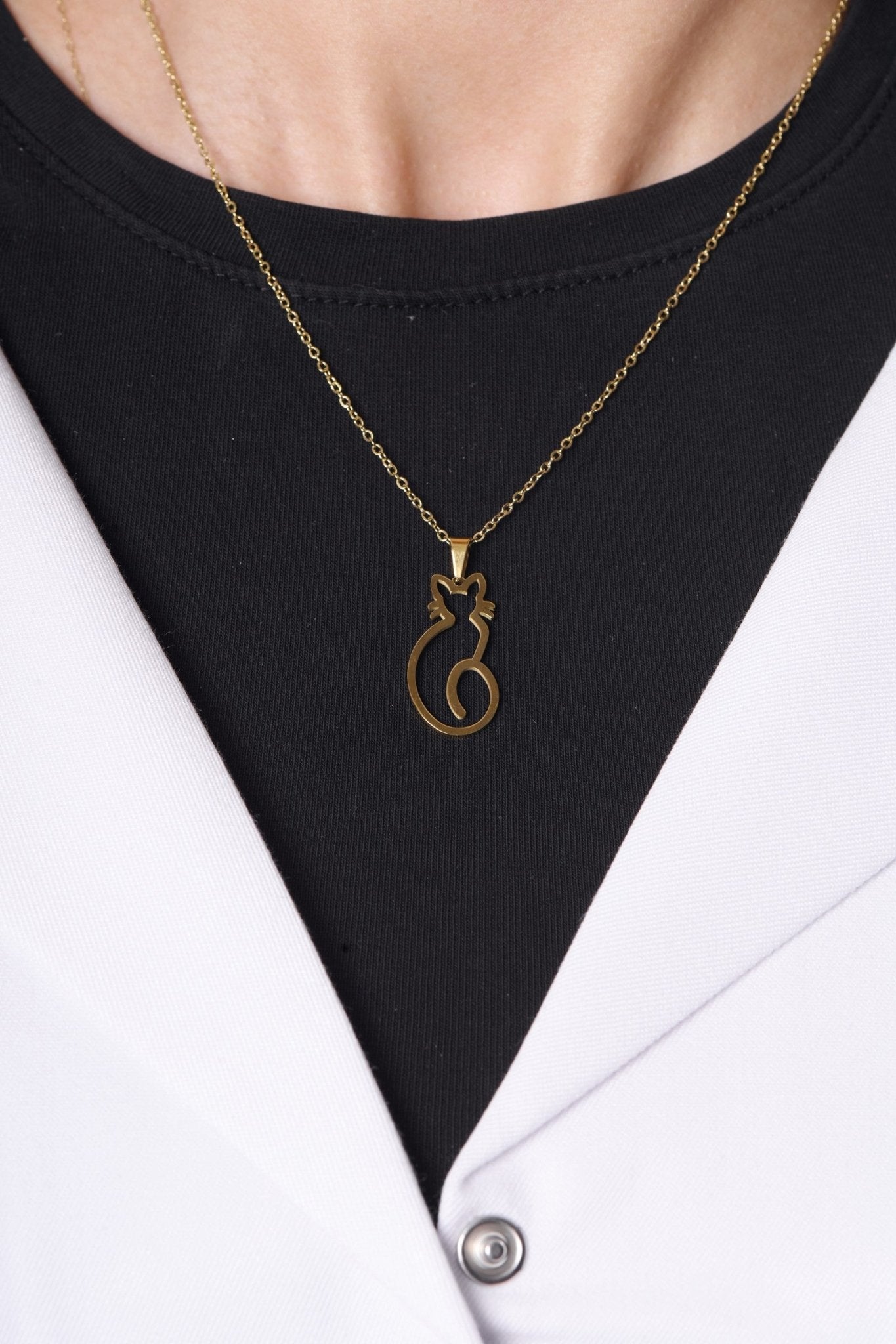 Cat pendant worn with a BALTO lab coat