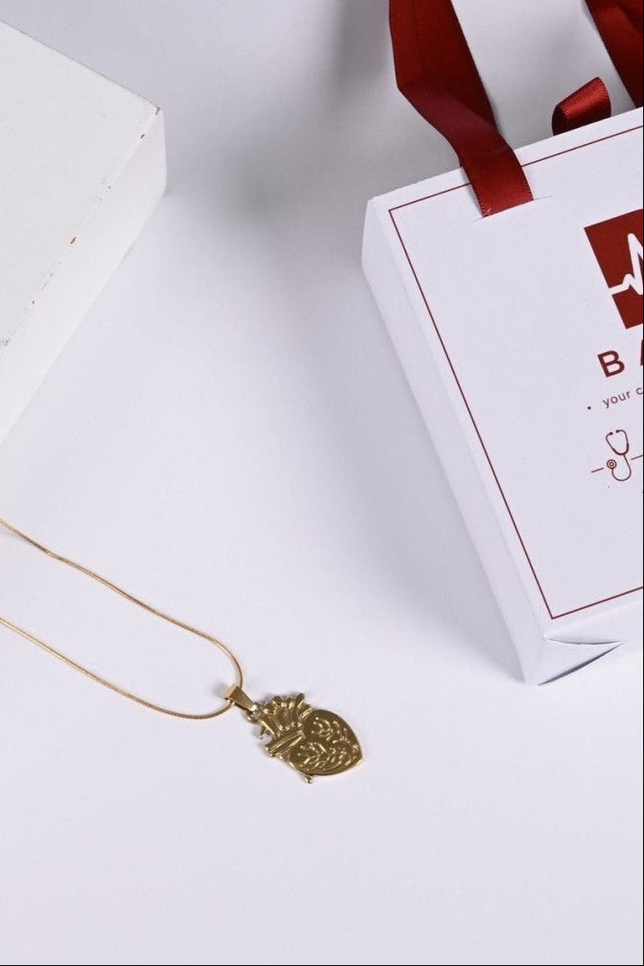Engraved anatomical heart pendant in gold on snake chain — BALTO