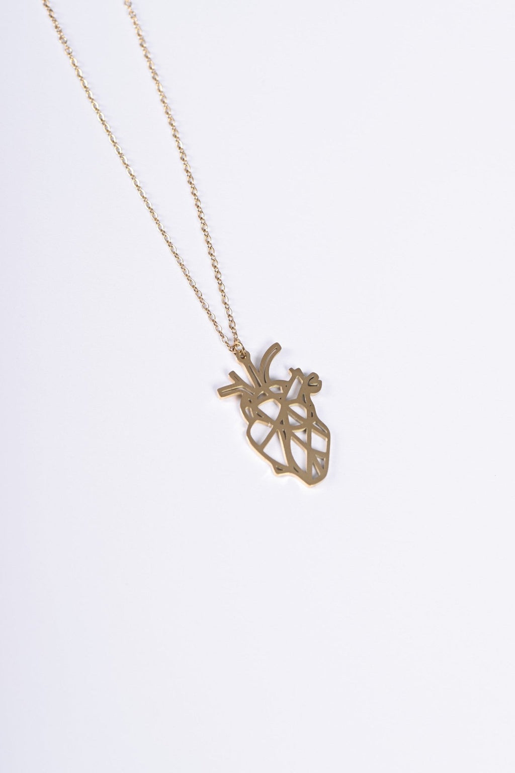 Geometric anatomical heart pendant in gold — BALTO