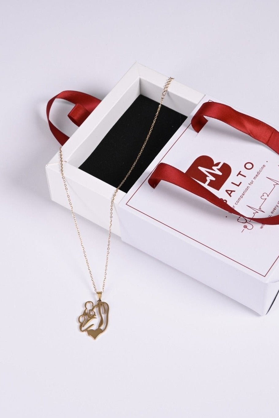 Gold mother and child pendant in BALTO gift box