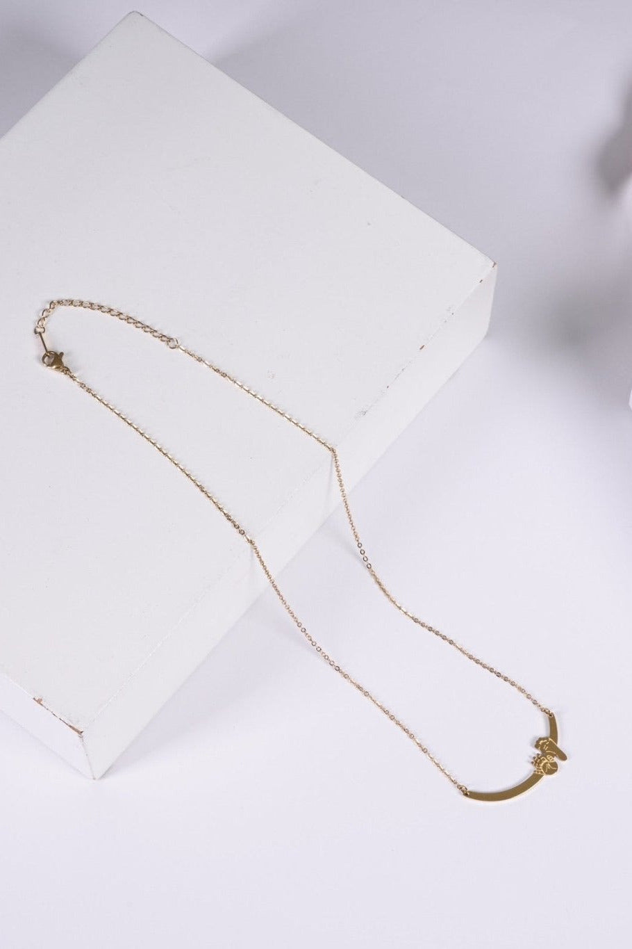 Gold hand and foot necklace with BALTO box and bag