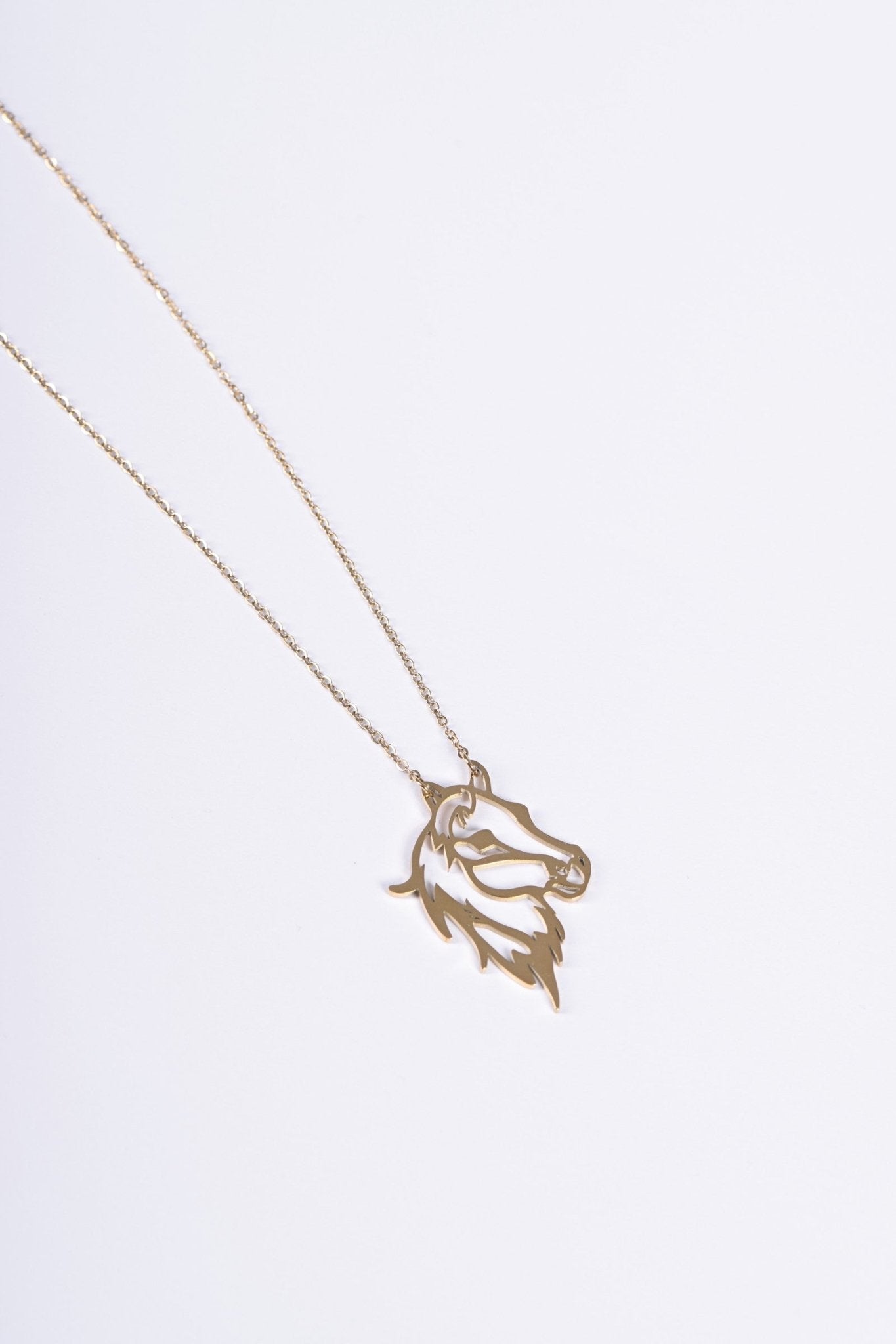 horse pendant in gold — BALTO
