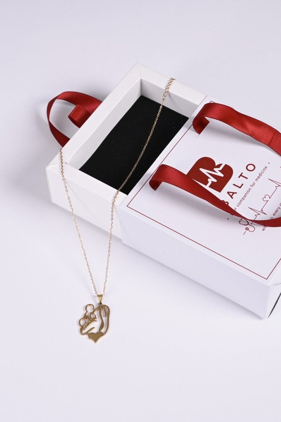 Gold mother and child pendant in BALTO gift box