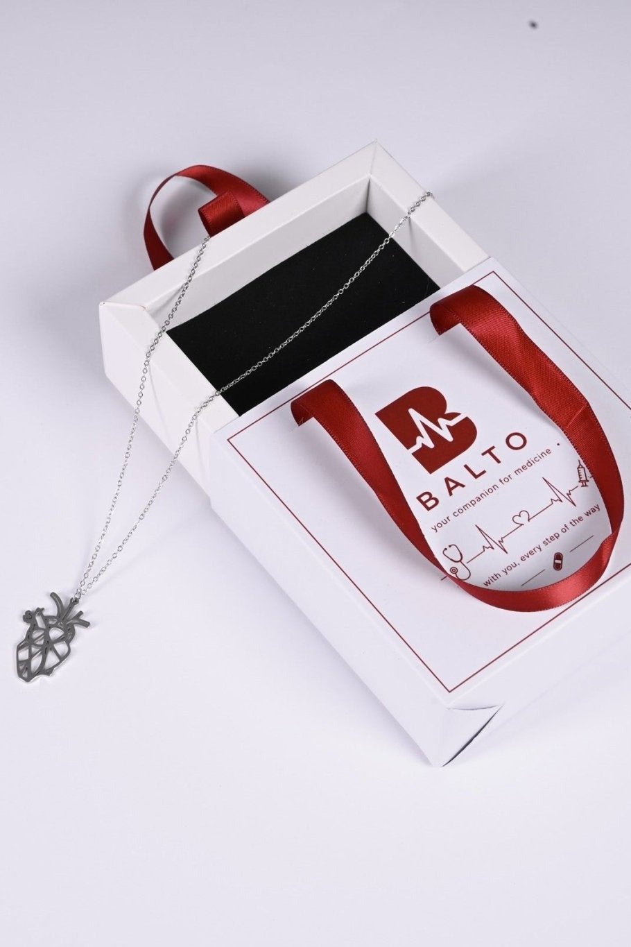 Silver anatomical heart pendant in BALTO gift box